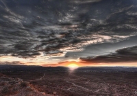 The depth of a sunset from Mormon Mesa lights up the valley of Overton, NV.	